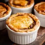 the ultimate comfort food guinness braised beef pot pie is ready to be eaten and served