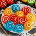 colorful jello rolls are being held up in front of the camera with text overlay that reads jello roll tips