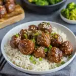 the meat is covered in sauce and garnished with parsley