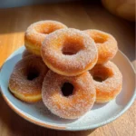 delicious homemade cinnamon sugar doughnuts with chocolate drizzle on top and bottom