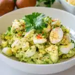 avocado egg salad on a white plate with the words low carb healthy keto