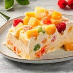 a piece of cake on a white plate with a cherry in the middle and one slice missing