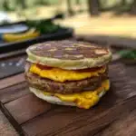 a stack of pancakes with cheese on top and the words, quick & tasty homemade mcgridle