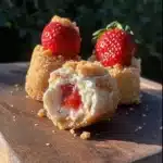 strawberry cheesecake crunch bites on a white plate
