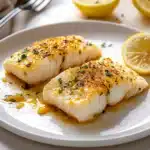 lemon garlic baked food on a white plate