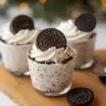 oreo cheesecake cups with cookies in the background and text overlay that reads easy no - bake oreo cheesecake cups
