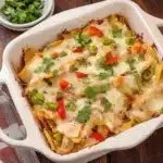two casserole dishes with cheese and vegetables in them