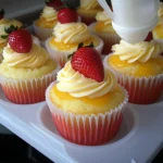 two pictures showing different types of cupcakes with strawberries and mango on top