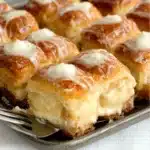 king's hawaiian cheesecake danish with icing on top and other ingredients around it