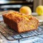 this southern peach bread is made with fresh peaches and topped with sour cream